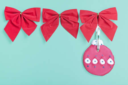 Christmas cookie hanging red ribbons  の写真素材