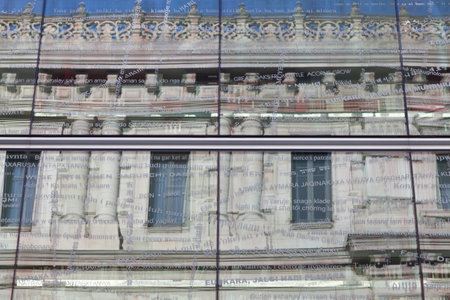 Bilbao, Spain, November 25, 2011. Classic building of the Provincial de Bilbao, reflected in modern...