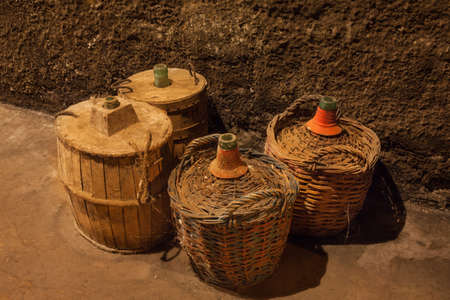 bottles of old wine in a cellarの写真素材