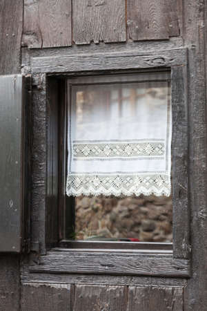 window in a rural hutの写真素材