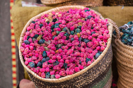 rosebuds in a basket on the marketの写真素材
