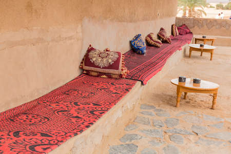 fabrics, wool blankets and cushions Moroccan adobe on a bench on a terraceの写真素材