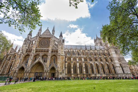 London, UK - May 14, 2016- Westminster Abbey or Collegiate Church of St. Peter of Westminster is an Anglican Gothic church the size of a cathedral. It is located in Westminster, London, next to the Palace of Westminster. There are people queuing to enterのeditorial素材