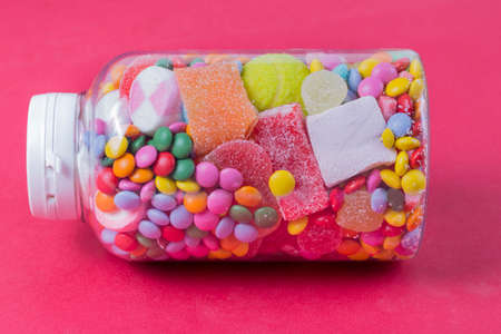 Glass jar full of candiesの写真素材