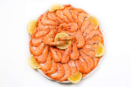 Plate of prawns adorned with tracks of lemonの写真素材