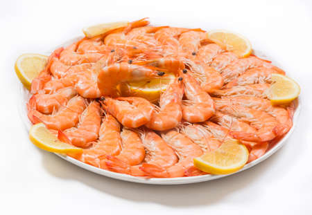 Plate of prawns adorned with tracks of lemonの写真素材