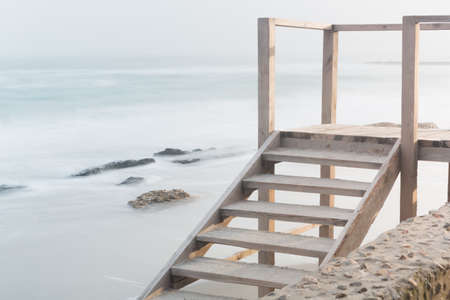 Seashore, sandy beach, blurred wavesの写真素材