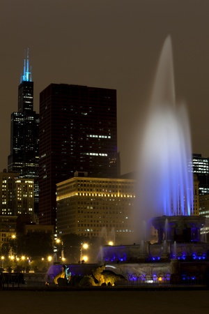 Chicago Famous Fountain and the Skyline on an overcast nightの写真素材