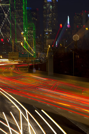 Abstract zoom of  people commuting to downtown Dallas Texas at Night 