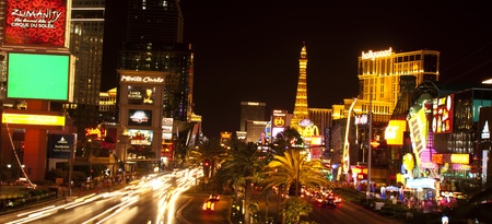 Nightlife along the Las Vegas Strip in front of the Paris Casino  Picture shows shops, Planet Hollywood Casino, the Eiffel Tower replica at Bally s Paris Casino on the left side and part of New York - New York and Monte Carlo Casino on the right sideのeditorial素材