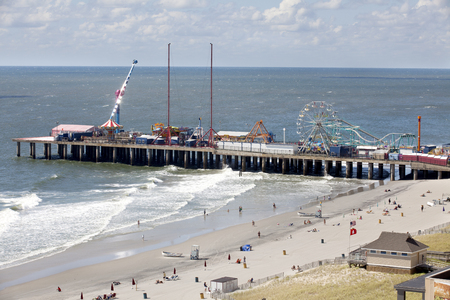 Aerial view of the famous Steel Pier in Atlantic City, New Jersey with people enjoying the beach in the early morningのeditorial素材