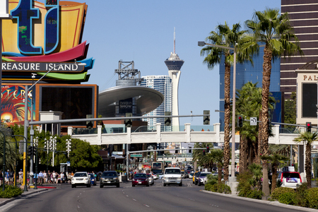 Look down the famous Las Vegas Blvd whic is known as \"The Strip\" showing the Treasure Island sign, Fashion Show Mall and the Stratosphere towerのeditorial素材