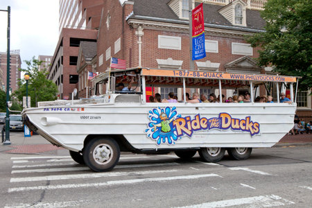 Tourist enjoying a ride on Ride The Ducks in historic Old City  Philadelphia Pennsylvania. Duck...