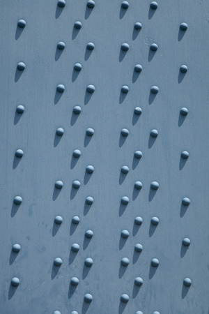 Background pattern of a steel beam with rivets. Close up detail of the Ben Franklin Bridge in Philadelphiaのeditorial素材
