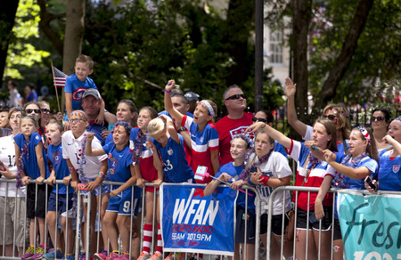 Crowds of fans of the USA women's soccer team fans line Broadway's Canyon of Heroes during the ticker tape parade to celebrate the U.S. women's soccer team FIFA World Cup victory in downtown New York Cityのeditorial素材