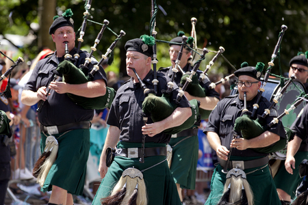 New York City Sanitation Department Bagpipe Marching Band peforming during the ticker-tape parade along Broadway's Canyon of Heroes celebrating the FIFA World Cup Champions US Women National Soccer Team in downtown New York Cityのeditorial素材