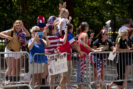 Crowds of fans of the USA women's soccer team fans line Broadway's Canyon of Heroes during the ticker tape parade to celebrate the U.S. women's soccer team FIFA World Cup victory in downtown New York Cityのeditorial素材