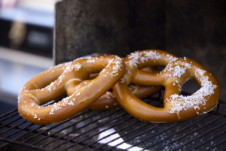 Hot pretzles warming on a BBQ Grill  note- selective focusの写真素材