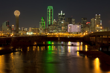 Downtown Dallas, Texas at night with the Trinity River in the foregroundのeditorial素材