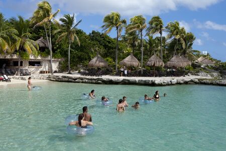 People vacationing in Cancun Mexico, enjoying a beautiful day at the beach on a beautiful calm dayのeditorial素材