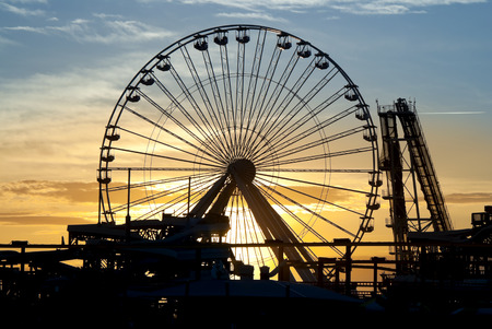 Ferris Wheel and roller coaster silhouette at sunset. Taken in Wildwood, New Jerseyのeditorial素材