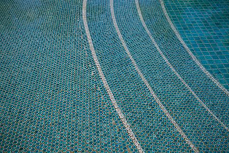 Blue and green pool tile underwater. Background textureの写真素材