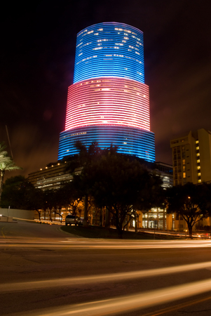 Highrise office building in Miami, Florida lit up in red white and blueのeditorial素材