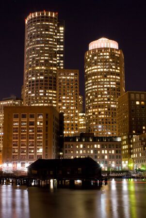 View ofthe skyline of Boston Massachusetts at night from across Fort Point Channel.の写真素材
