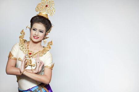 Beautiful lady dancing for original Thai dance with golden costume.のeditorial素材