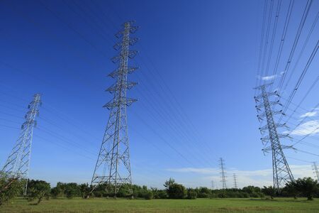 Energy tower with blue sky and green nature.の写真素材