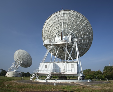 Radar dish with blue skyの写真素材