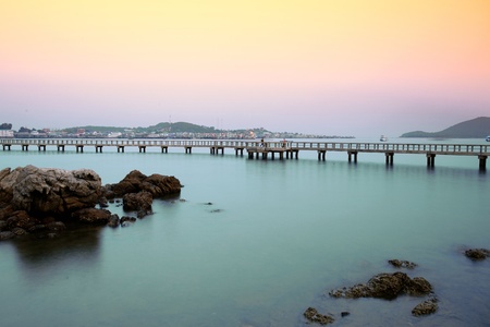 Long bridge in the sea, at the bay in Thailand.の写真素材