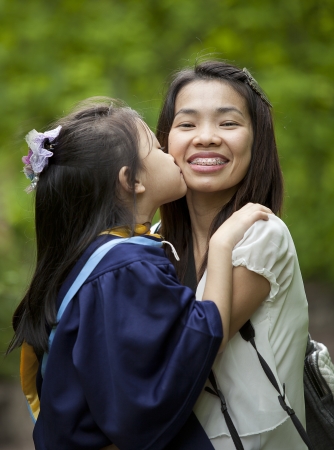 Achievement of degree for young girl in the green nature.の写真素材