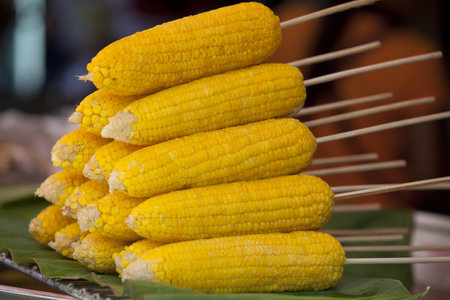 grilled corn put stacking for sales in Thai market.