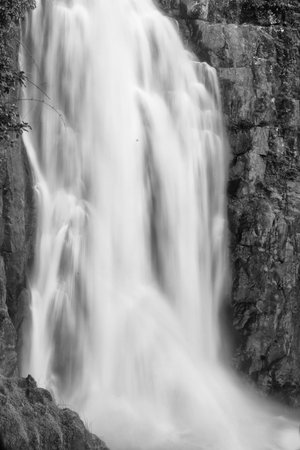 waterfall in deep forest with big rapid flow
