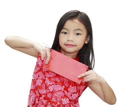 asian girl holding red packet,chinese new year theme. Character on the red pack symbolizes coming of chinese new year の写真素材