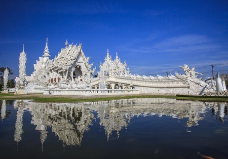 Magnificently grand white church and reflection in the water, Rong Khun temple, Chiang Rai province, northern Thailandの写真素材