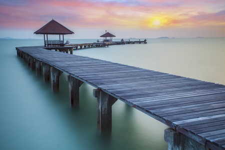 Wooded bridge in the port between sunrise.の写真素材