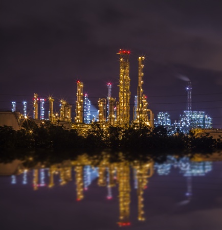 Tower in stream power plant with water reflexの写真素材