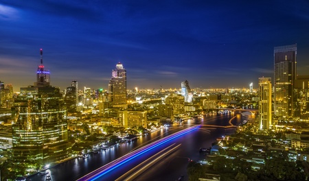 River in Bangkok city in night time with bird viewの写真素材