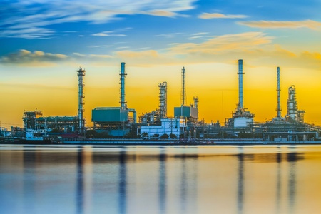 Refinery industrial plant with river and sunsetのeditorial素材