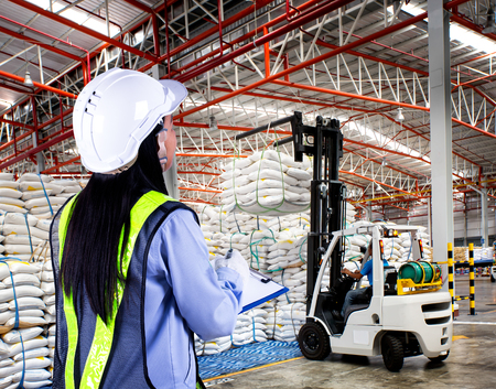 Forklift loader with big bag of sugar in distribution warehouseの写真素材