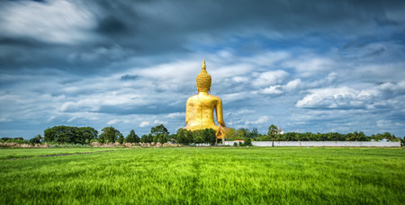 Wat Muang with gilden giant big Buddha statue in  Thailandの写真素材