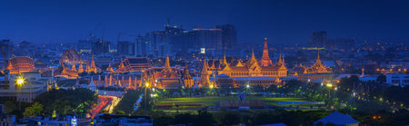 Landscape of Thai's king palace with goldent pagoda and main gardent on the front.