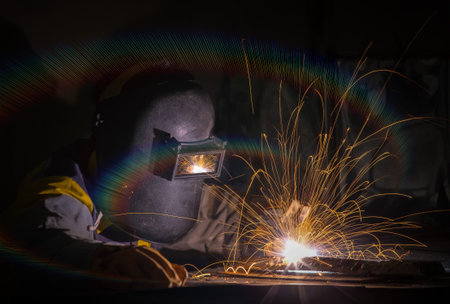 worker work hard with welding process in production plant