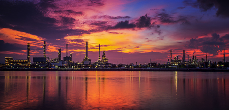 petrochemical plant in night time with reflection over the riverの写真素材