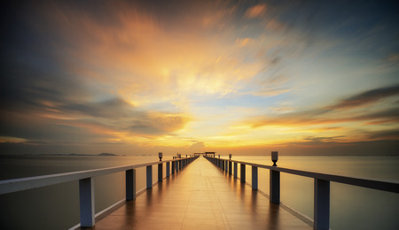 Wooded bridge in the port along sunrise.の写真素材
