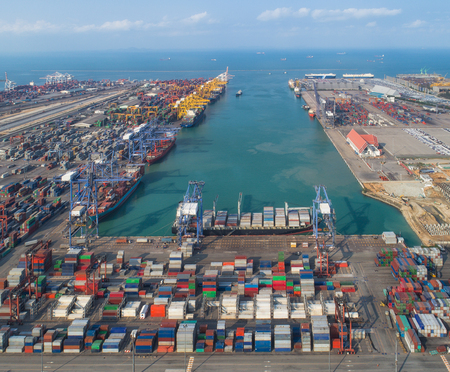 Logistic port, vessel transportation and import, export business with boat and craneの写真素材