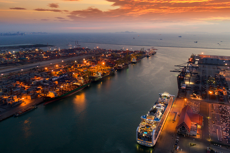 Vessel and container box in logistic port under loading by craneのeditorial素材