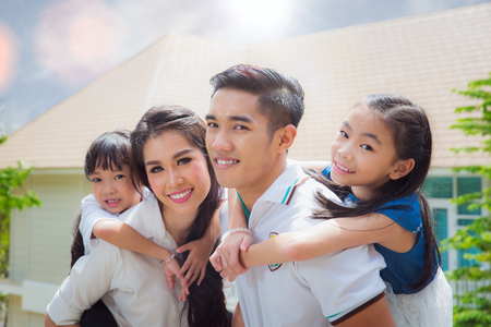 Asian family stand togather with famther, mother and Daughter on home terace, Asia family and out door conceptの写真素材